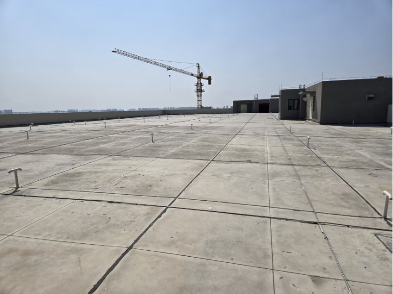 On-site rooftop survey: engineers measuring, structural assessment, waterproofing checks